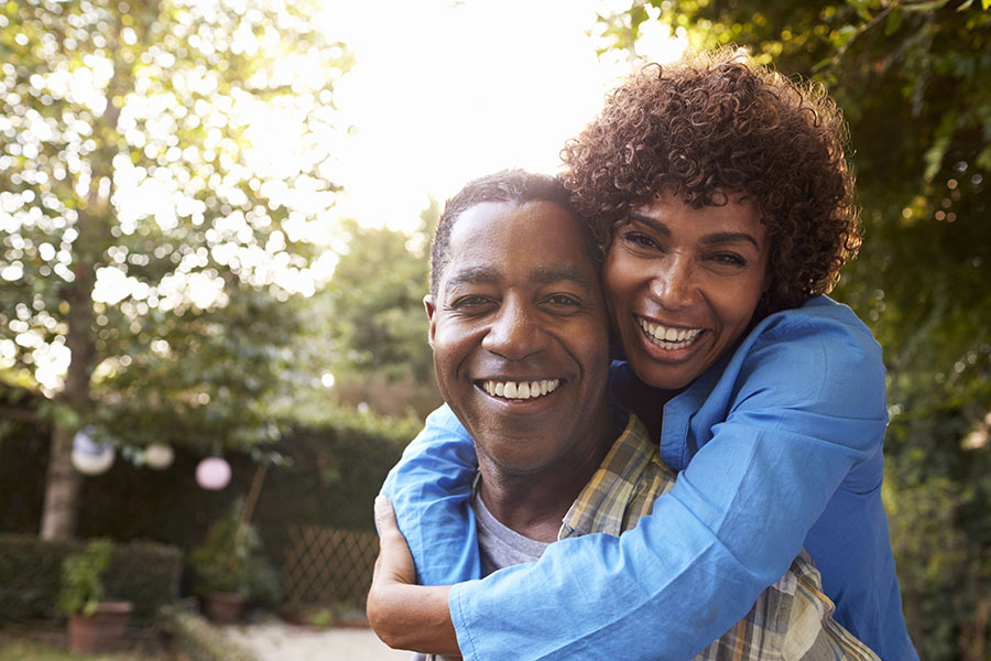 Life and Health Insurance - View of Happy Mature Couple Standing in the Backyard